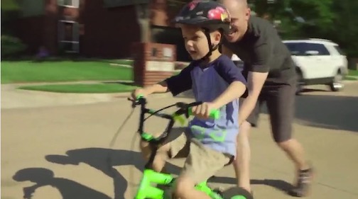 Dad and son bike riding